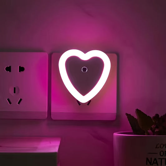 Heart-shaped LED night light with built-in sensor and European plug for indoor use. Ideal for stairways, bedrooms, kitchens, and hallways. Not waterproof. Can be wall-mounted.