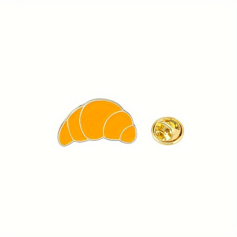 Set of five cartoon-inspired cute breakfast food enamel pins featuring bread-shaped minimalist brooches. These decorative lapel pin badges can be used on bags and jewelry to add a fun touch with pastry and egg-themed accessories.