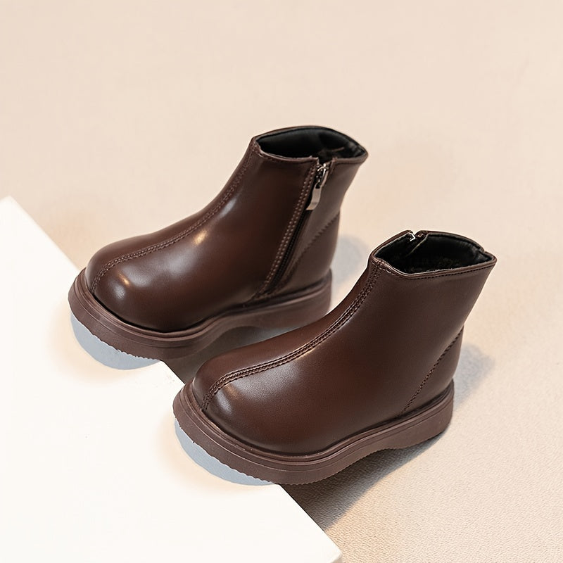 Warm fleece-lined kids' boots with soft soles and zip closure, ideal for outdoor activities in fall and winter.