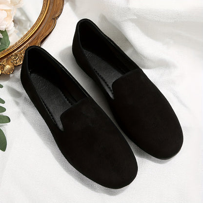 . 

"Black flannel slip-on flats with round toe, lightweight plastic sole, and man-made insole for all-season comfort