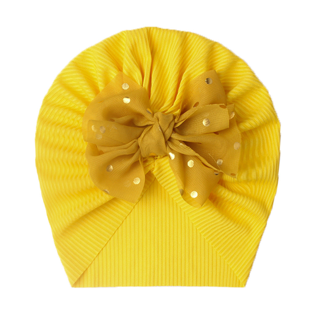 Polka dot printed bow head wrap for newborn infants and toddlers.