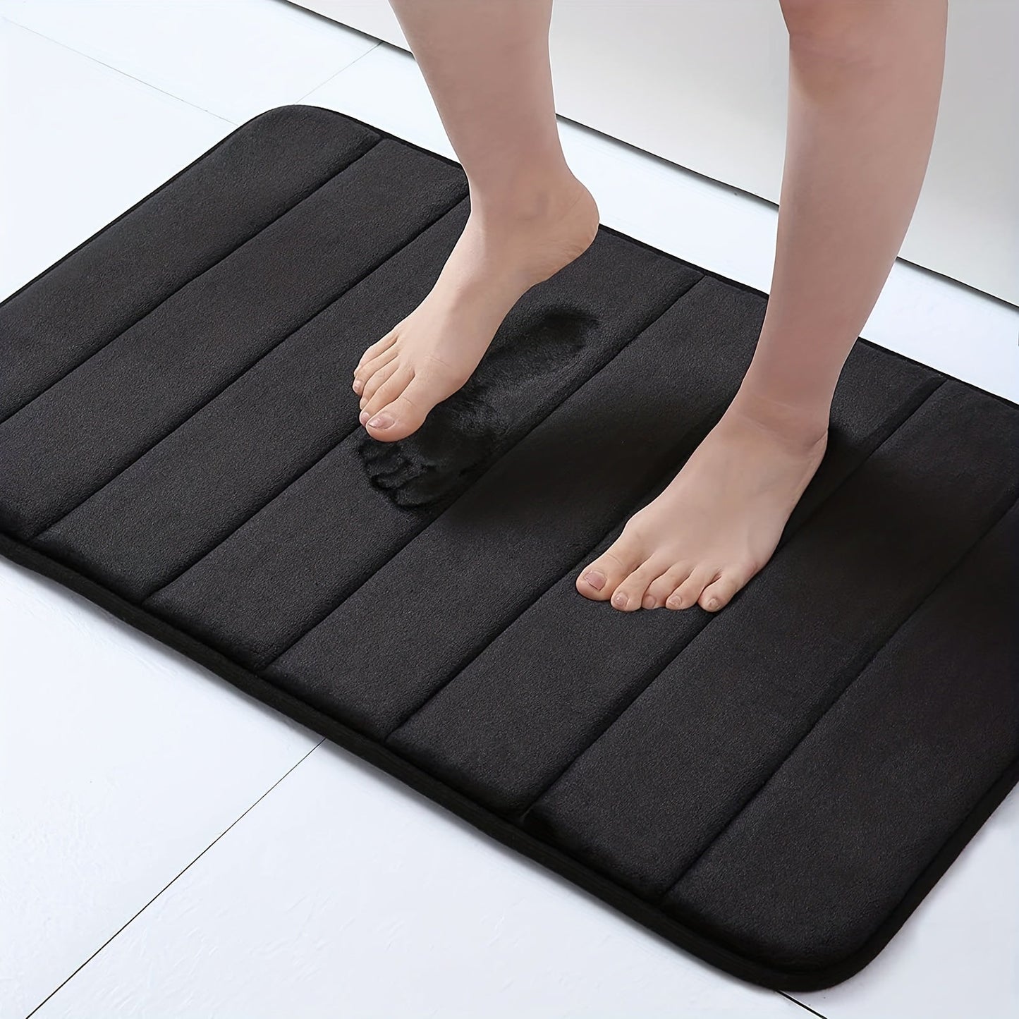 1 piece of Memory Foam Bath Mat designed for the bathroom, featuring a non-slip surface and thickened soft material that quickly absorbs water and dries fast. This machine-washable mat can also be used as a shower mat, living room or bedroom entrance