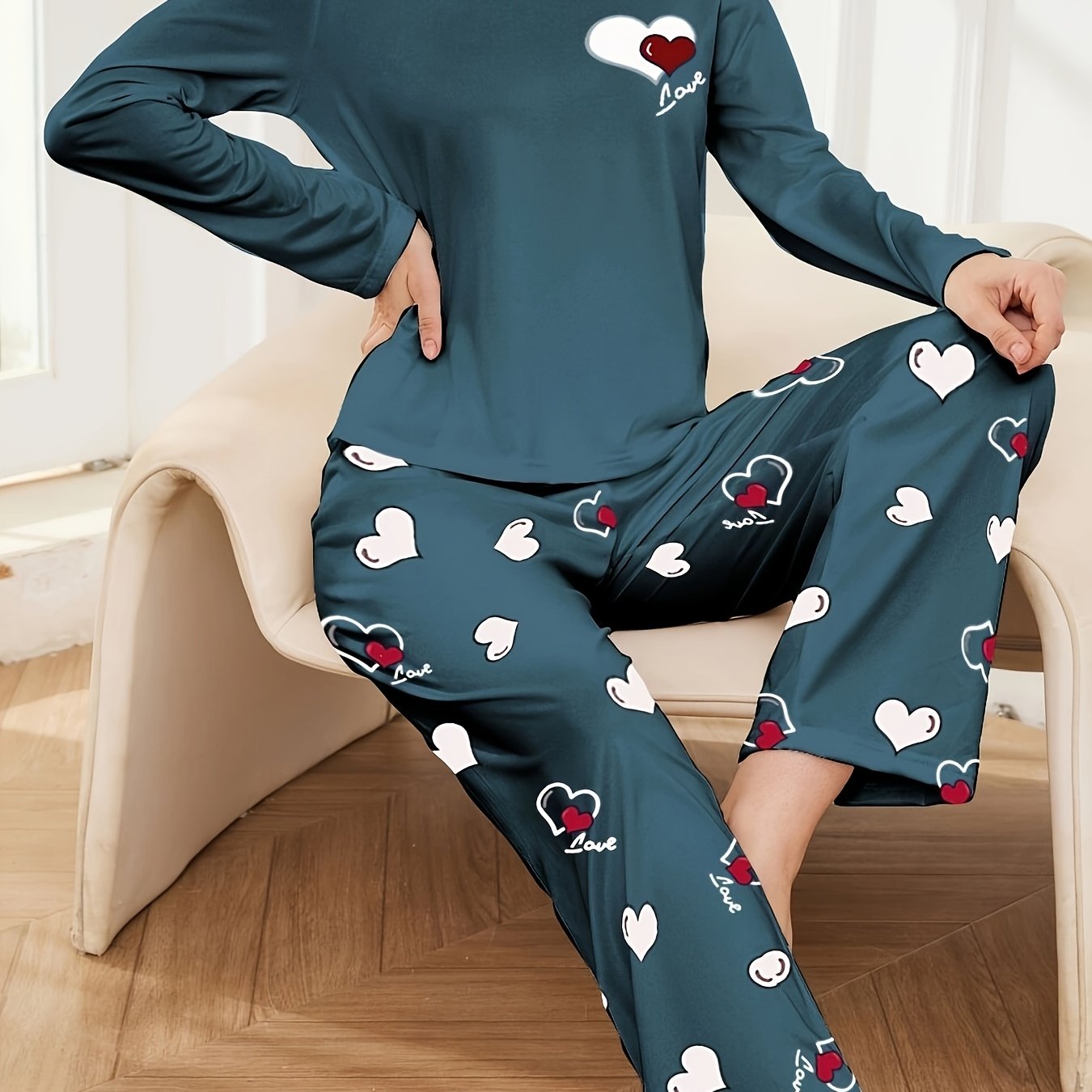 Women's heart print 2-piece pajama set includes long sleeve crew neck top and elastic waist pants in cozy polyester blend for fall/winter.