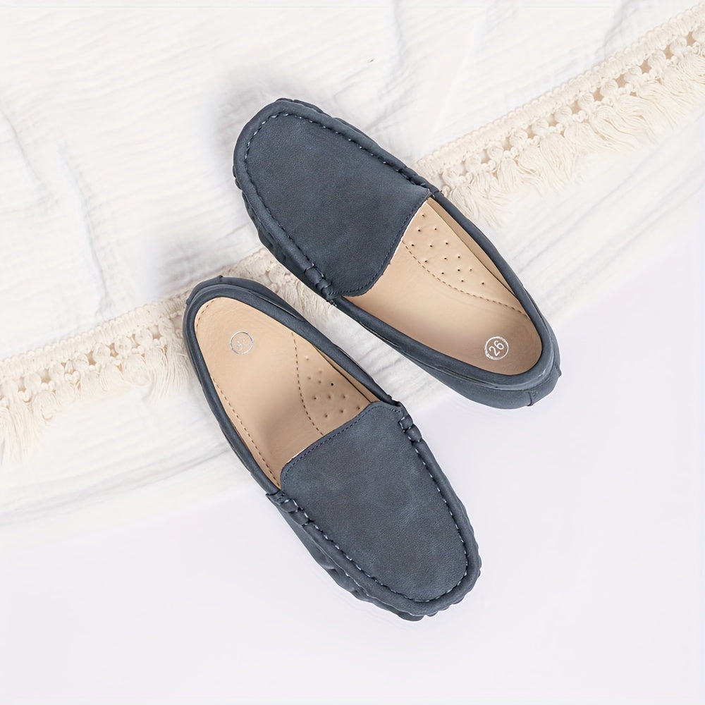 Boys' slip-on loafers in black and brown, suitable for all activities.