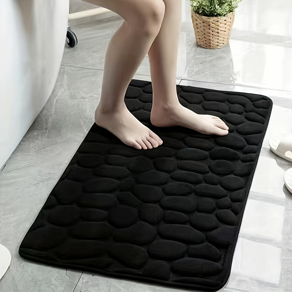 Upgrade your bathroom with the luxurious 1PC Pebble Embossed Memory Foam Bath Mat. This quick-drying carpet not only adds a touch of elegance to your living room but also provides a comfortable and washable non-slip surface for your bathroom. Elevate