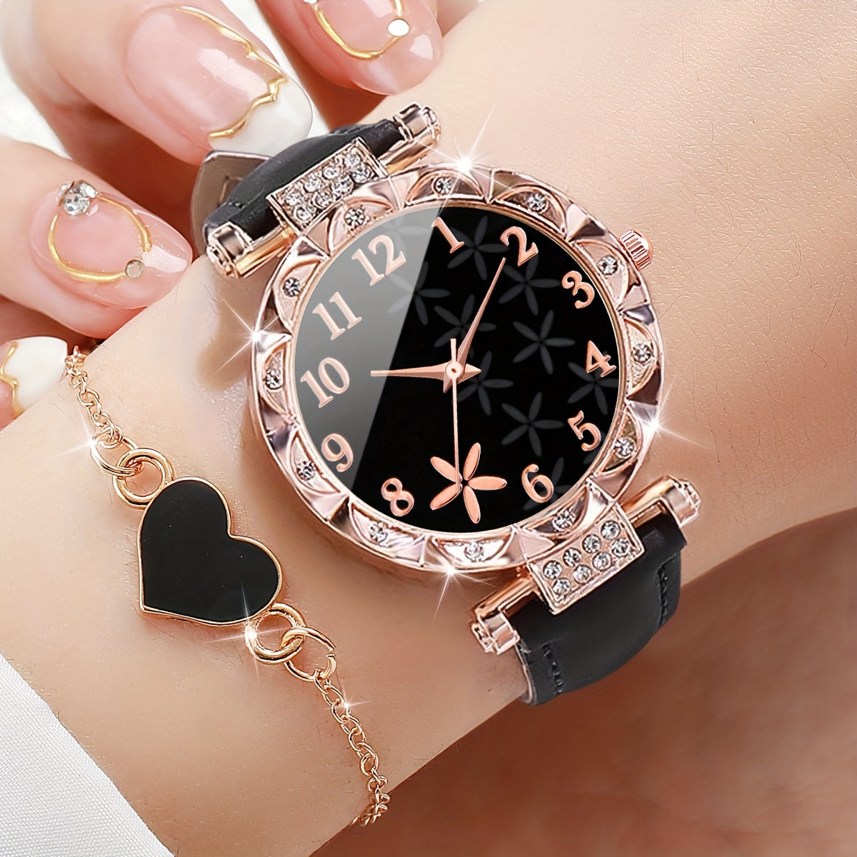 2-piece set includes minimalist flower petal quartz watch and heart chain bracelet. Watch box not included.