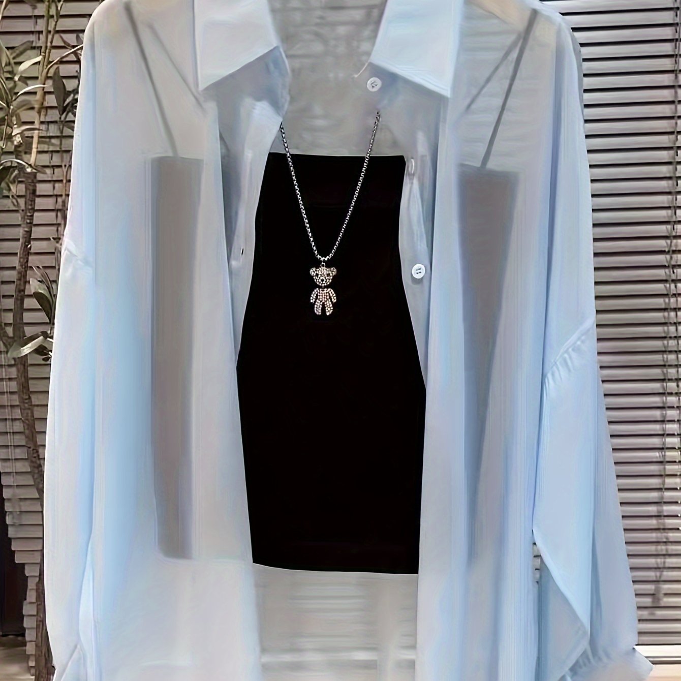 Casual women's shirt with buttons, sheer long sleeves for spring and fall.