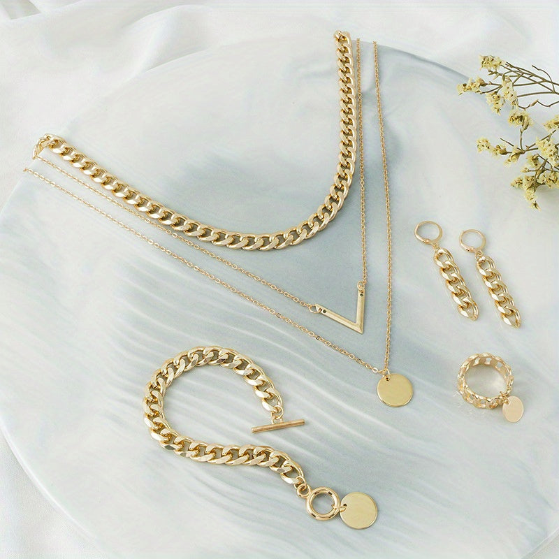 Choose your style with this trendy hip hop jewelry set featuring a 14k gold plated V shape pendant and chain design. The set includes 5 pieces - a necklace, bracelet, earrings, and ring. Available in golden or silvery tones, make your call now.