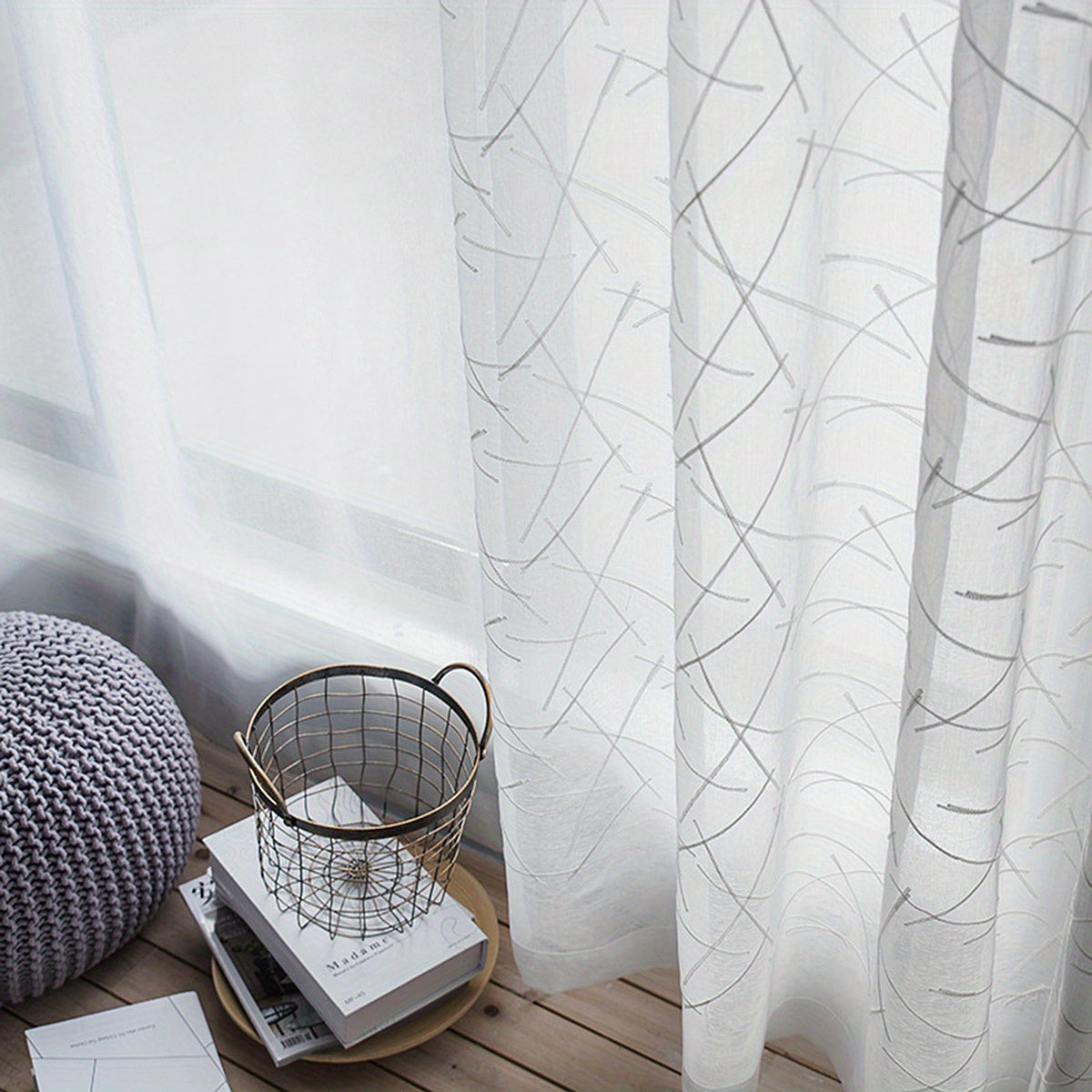 Create a modern and sophisticated look in your living room or bedroom with this 1-piece simple line embroidery sheer curtain. Featuring a sleek geometric design in white, this translucent curtain filters light beautifully while adding a stylish touch to