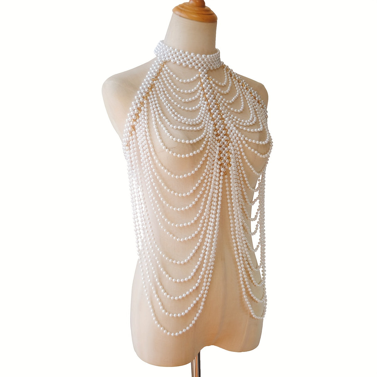 Luxurious and sexy, this female body chain features a creative design with exaggerated multi imitation pearl tassels, perfect for adding a touch of personality and style to any outfit.