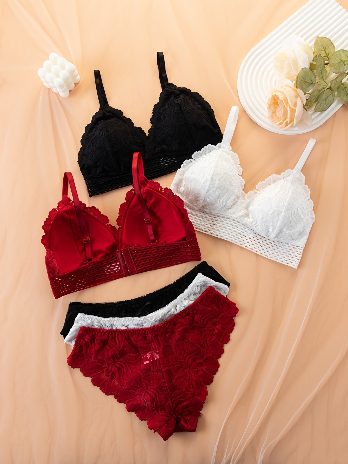 Elegant lace bra and panty set, comfortable wireless design with spaghetti straps and bow decorations. Women's lingerie and underwear set of 3 pieces.