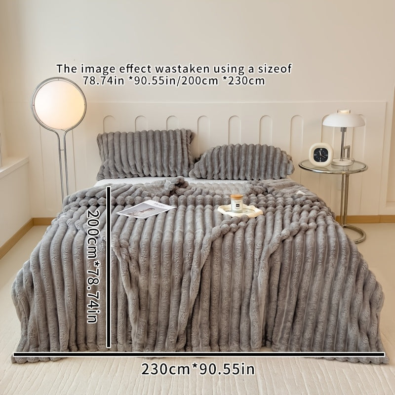 Stay warm and cozy with the FAGEJIE Luxury Faux Rabbit Fur Throw Blanket. Ideal for snuggling up on the sofa, bed, or while traveling. This all-season comfy gift is perfect for Christmas and is made of a soft polyester blend. Hand wash only and suitable