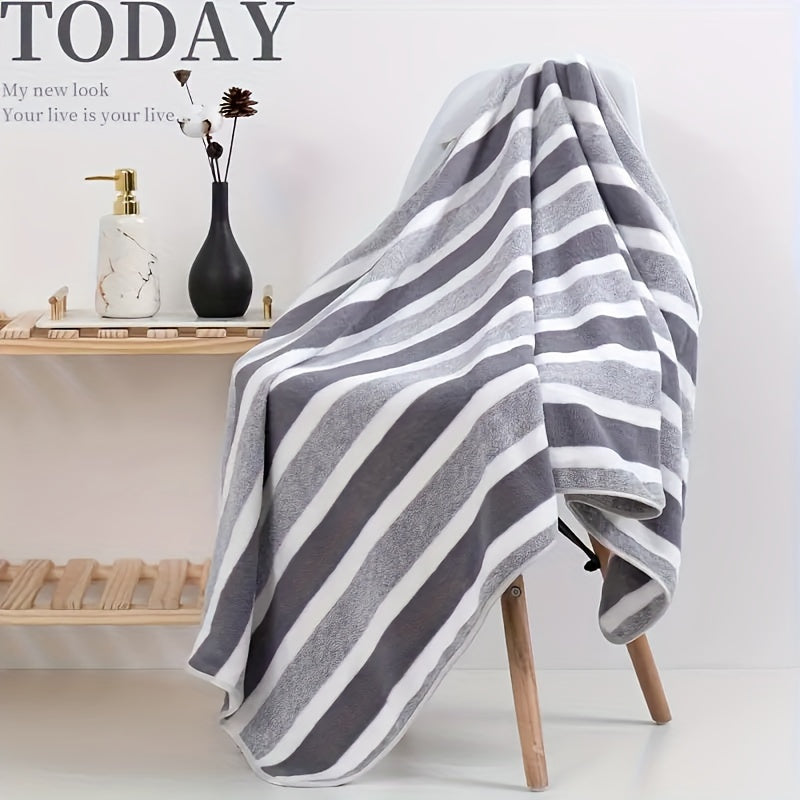 Large, soft, and super absorbent bath towel with modern striped blend design in a space theme. Made from knit fabric and quick-drying, weighing 280gsm. Ideal for adults.