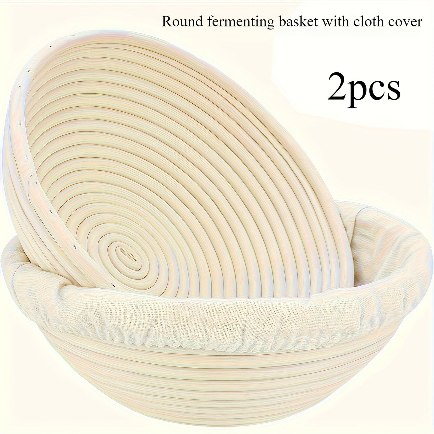 Set of two modern round bread proofing baskets with liners made from rattan. This banneton basket kit is ideal for baking artisan sourdough bread, providing a non-stick fermentation basket for home bakers and bread making.