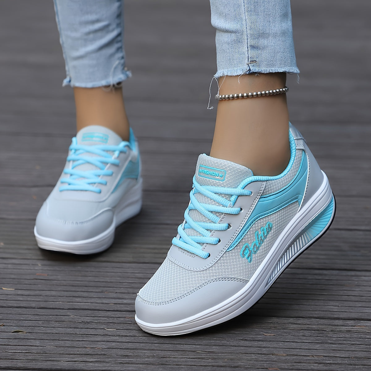 Women's platform sneakers with breathable mesh, lace-up design, and comfortable fit in plus size