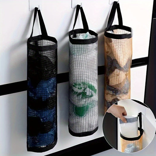 Wall-mounted, foldable mesh organizer for disposable bags, designed to save space in the kitchen.