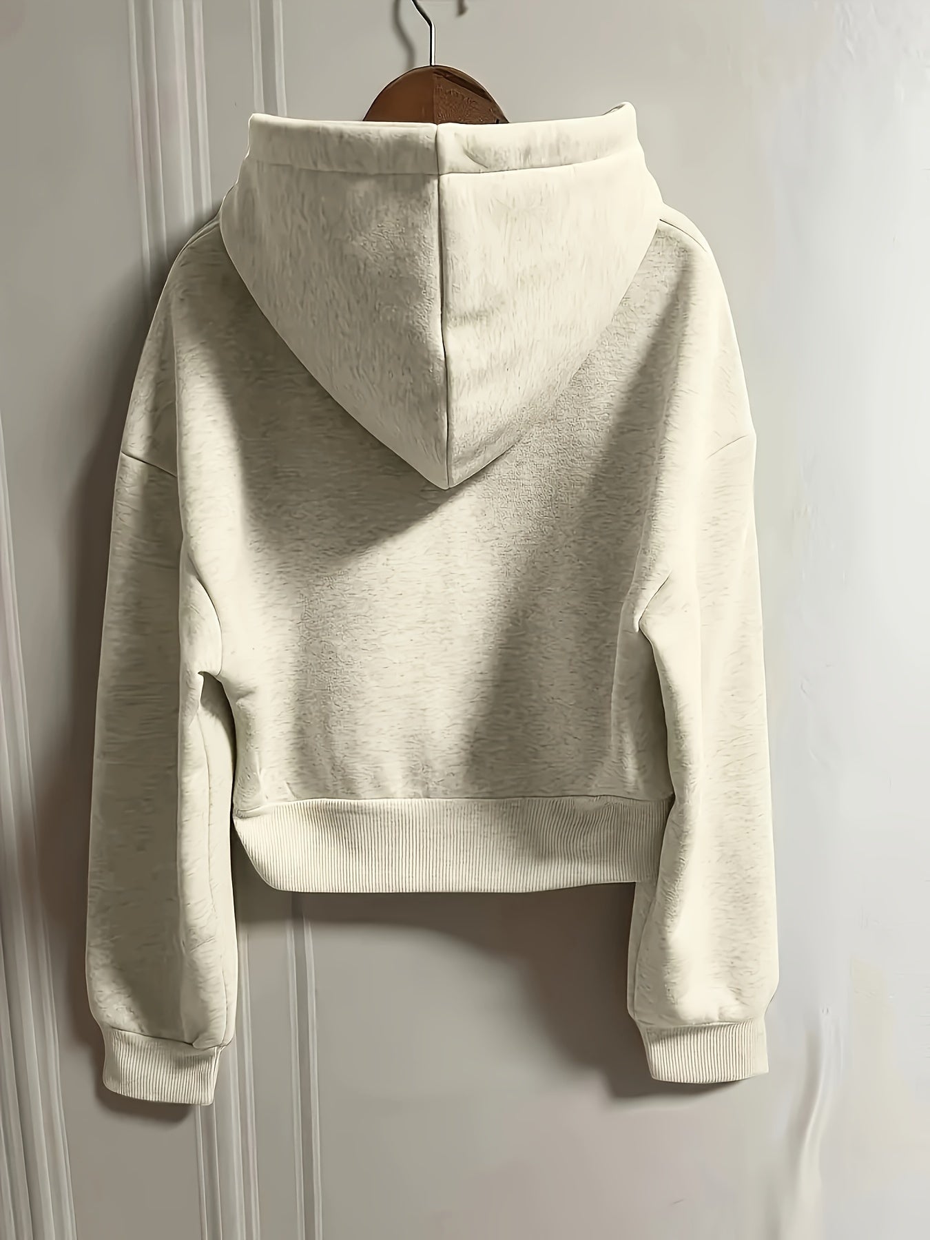 Women's casual polyester hoodie with slight stretch, solid color, pockets, and knit fabric for all seasons.