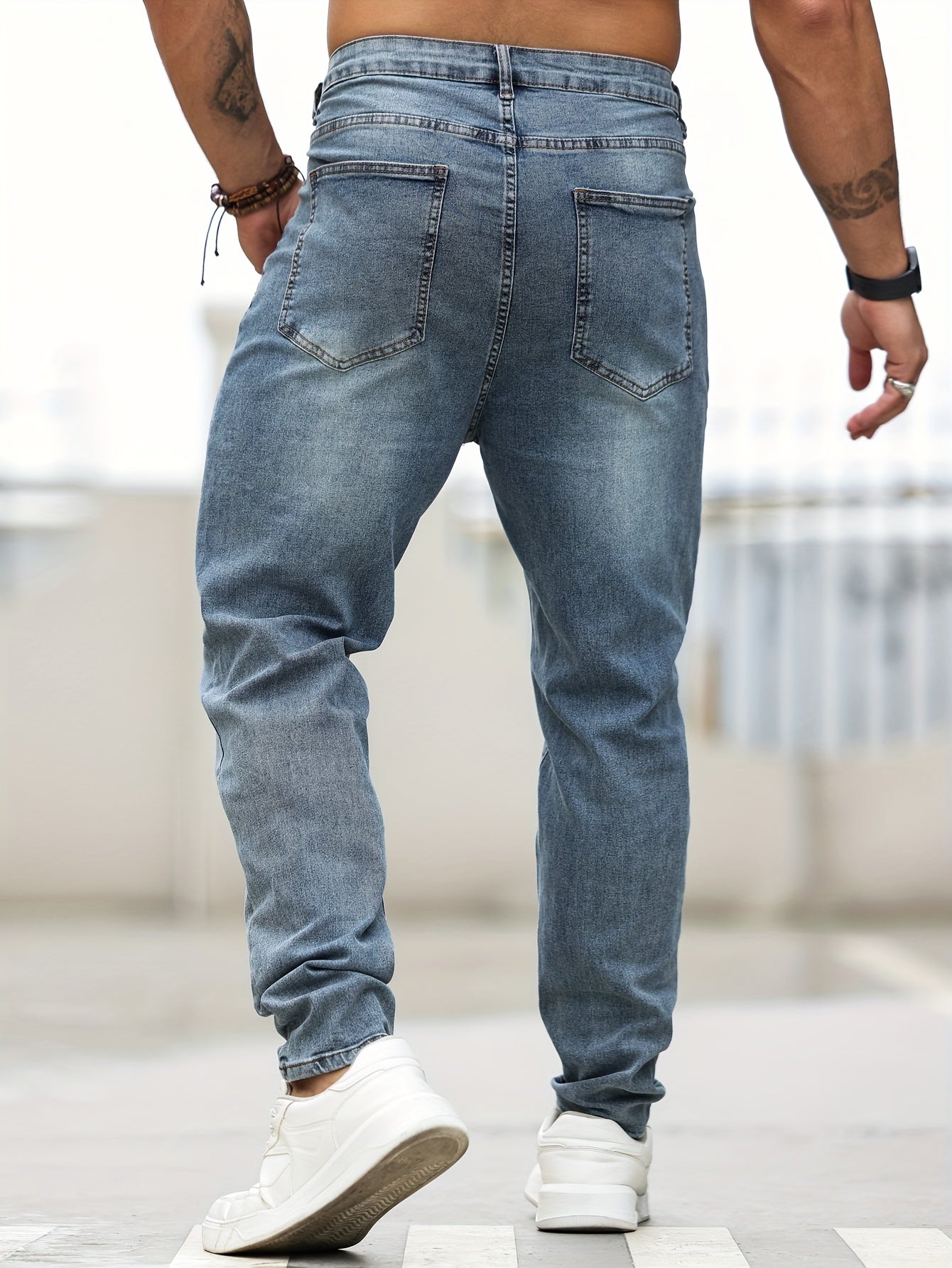 Men's plus size skinny jeans made of 68% cotton, 24% polyester, 6% tencel, and 2% elastane. Features casual solid color denim with pockets and medium stretch. Suitable for all seasons.