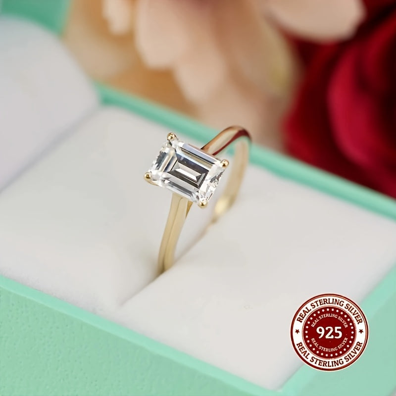 This stunning 925 Sterling Silver ring features a rectangular Cubic Zirconia stone, exuding elegance and luxury. It is perfect for both casual wear and gifting, with its simple yet sophisticated golden design. The simulated diamond comes in sizes of 1CT