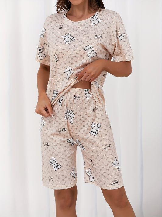 Women's sleepwear set featuring a cute bear and letter print, short sleeve top, and capri pants with a crew neck.