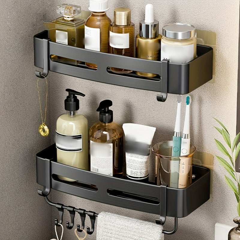 Wall-mounted bathroom storage rack for shampoo, shower gel, and cosmetics; made of space aluminum with no need for drilling.