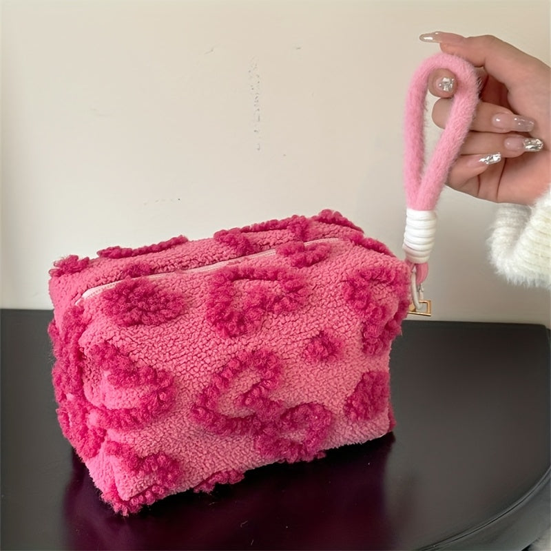 Heart-shaped hand carry bag for women, ideal for on-the-go skin care and cosmetic storage.