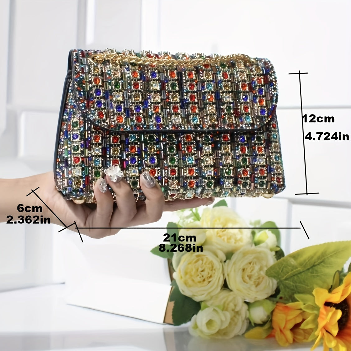 Stylish women's evening clutch with rhinestones and beads, adjustable strap, and magnetic closure, perfect for formal events.