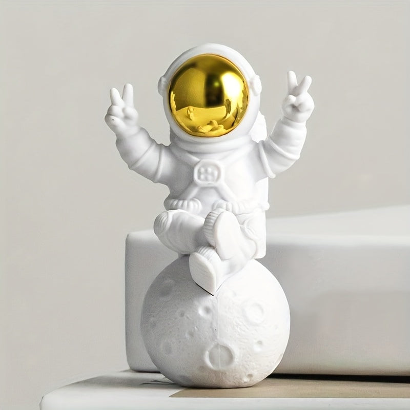 Chic astronaut figurine set with golden egg decor - perfect for home or office; great birthday gift for space enthusiasts.