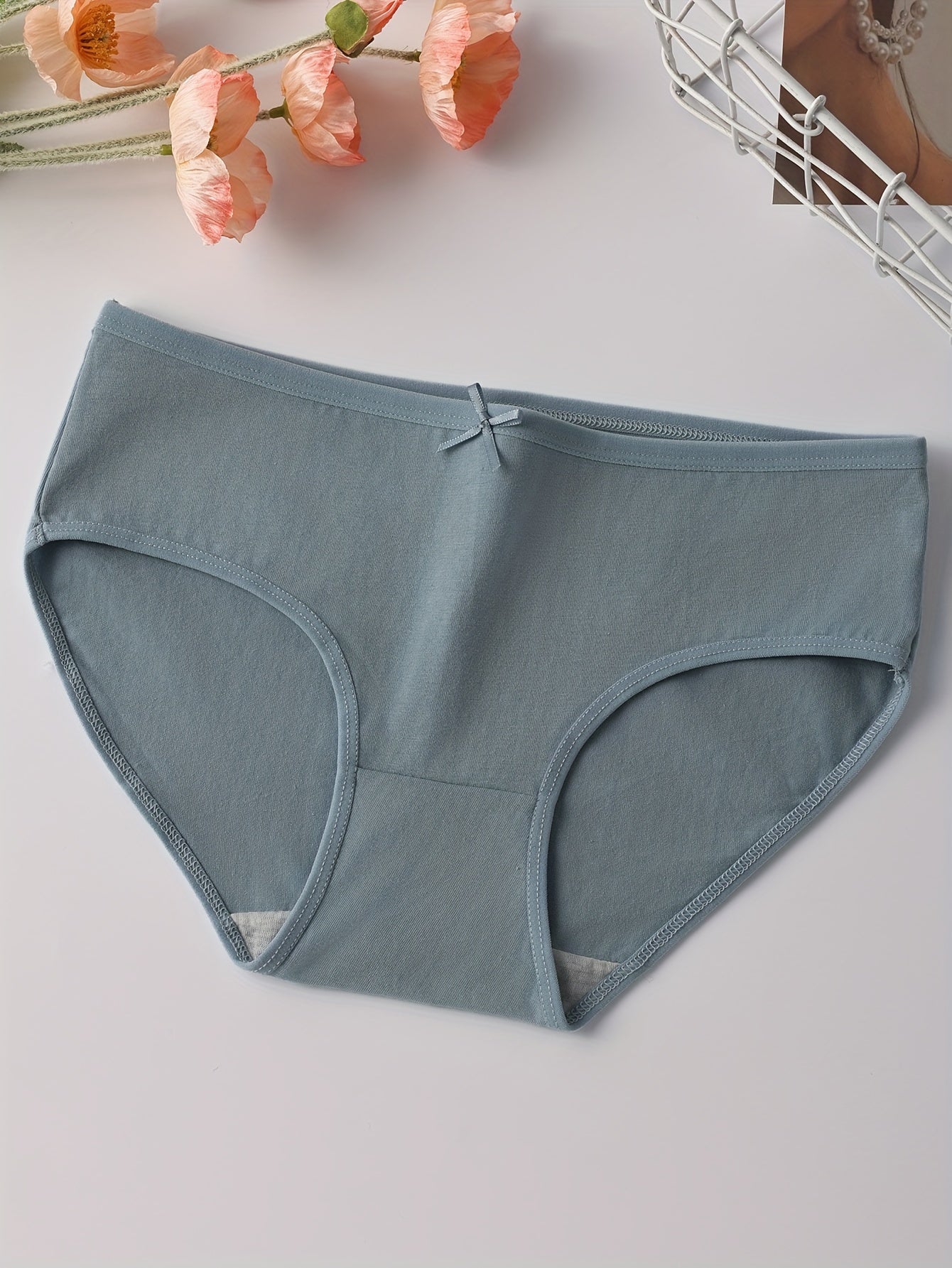 4 soft women's briefs with low rise, cute bow detail, comfortable fit, breathable and stretchy.