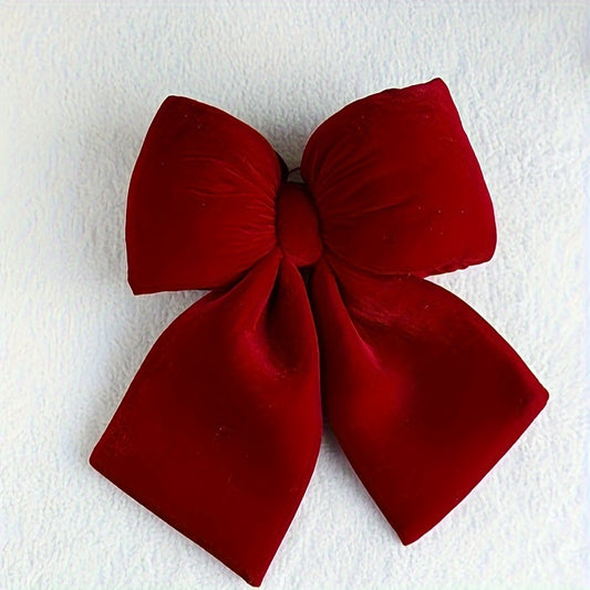 Christmas decorations include a handrail bow, fireplace bow, large velvet ornament bow, and red tree bow.