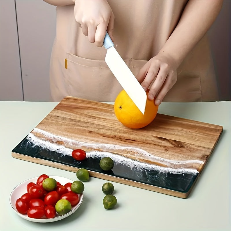 Get your hands on the stylish Wavy Resin Acacia Wood Cutting Board for home use. This creative cutting board is safe for food contact and perfect for slicing fruits and vegetables. Its unique wave design adds a touch of elegance to your kitchen, making