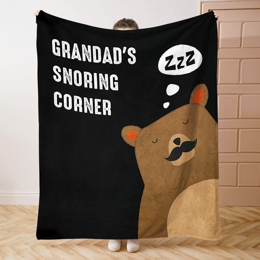 Soft and cozy polyester throw blanket with a contemporary knitted design featuring Grandad's Snoring Corner. This blanket offers all-season comfort for bed, sofa, office, or camping. Perfect as an ideal birthday gift for Grandpa.