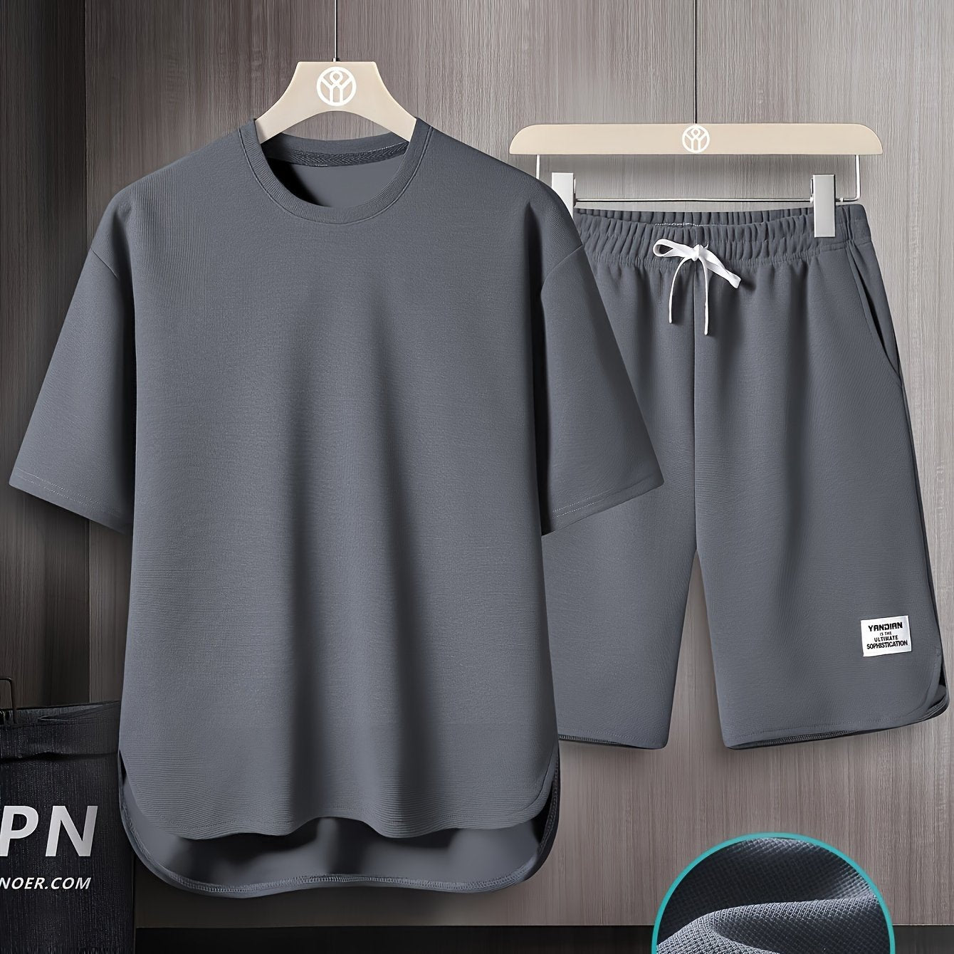 Men's summer short sleeve suit with high-end solid color round neck t-shirt and breathable thin shorts in a two-piece set called AWESOME BIRD.