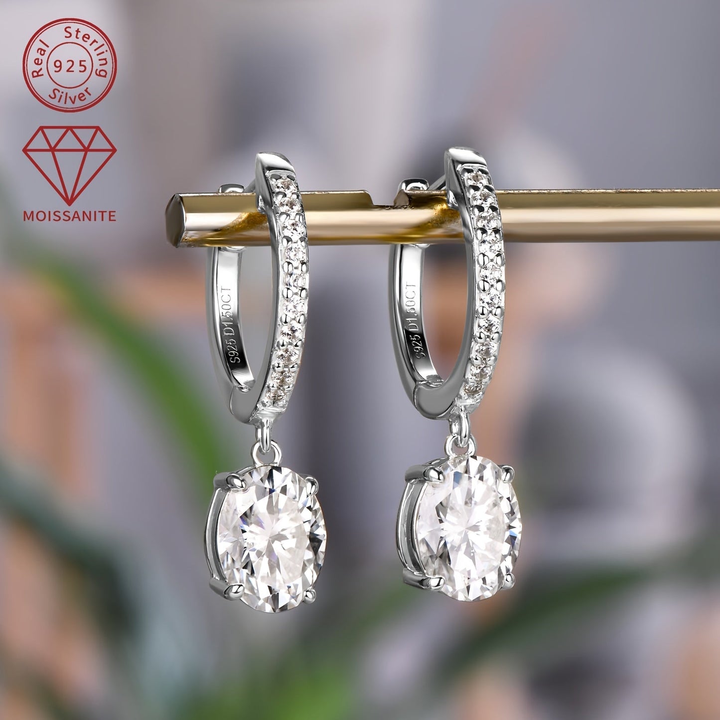 These exquisite silver earrings feature a pair of synthetic moissanite stones, each weighing 1.5ct. The main stones are 6x8mm in size, giving off a dazzling sparkle. These dangling earrings are perfect for adding a touch of glamour to any outfit.