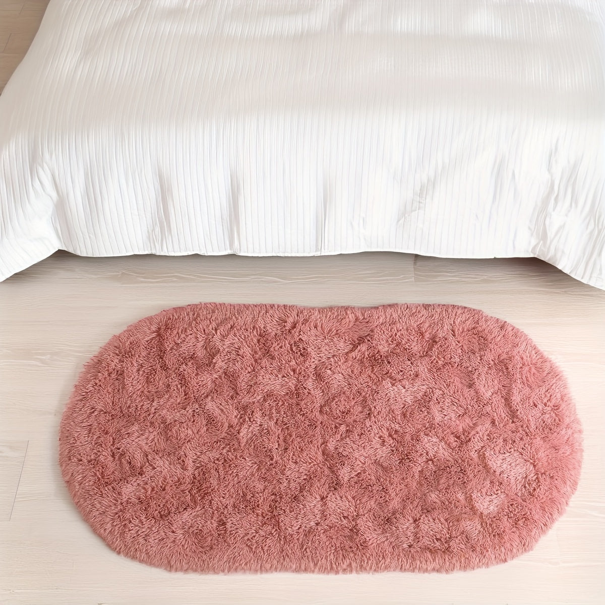 Soft and fluffy oval shaggy area rug, perfect for bedroom or living room. Made with skin-friendly thickened sponge and tufted polyester material. Durable and easy to maintain. Adds decorative touch to indoor spaces such as sofa, bedside, playroom, or