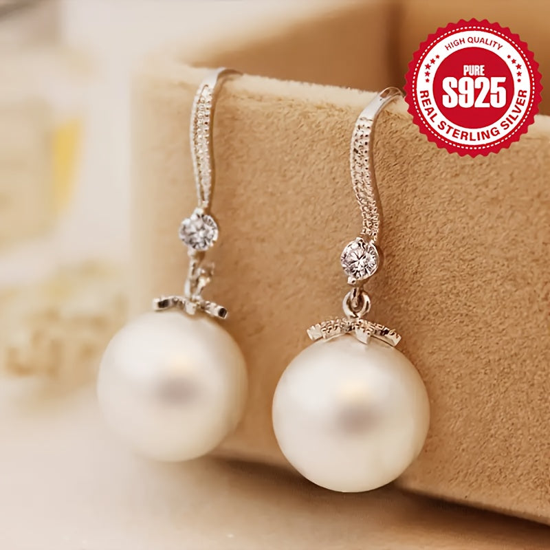 Stylish and hypoallergenic, these S925 sterling silver pearl earrings feature a minimalist design with a touch of sophistication, weighing 6.95g.