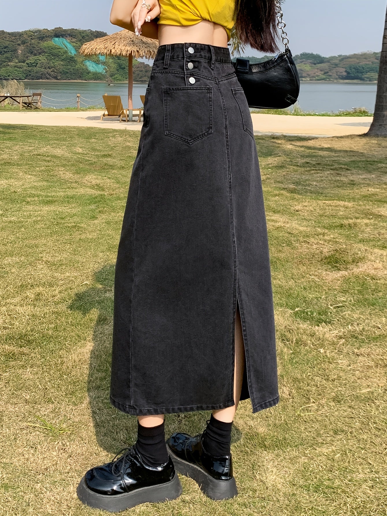 Casual denim midi skirt for women with side slit, mid-rise waist, straight cut, solid color, and pockets. Made of 55% cotton and 45% polyester blend.