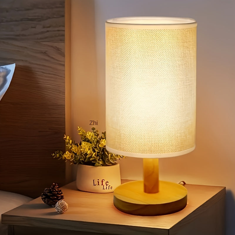 Modern solid wood table lamp with creative LED light, ideal for bedroom, study room, and guest house decor. Features natural wooden base.