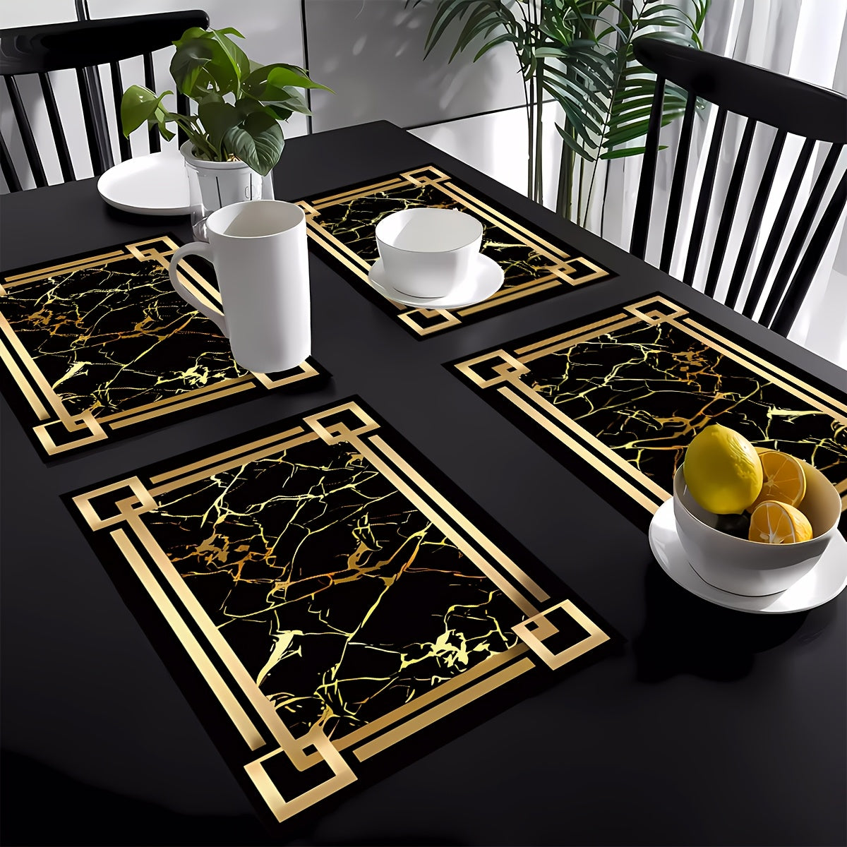 4 black and gold patterned table mats, ideal for kitchen or dining table décor and as a gift.