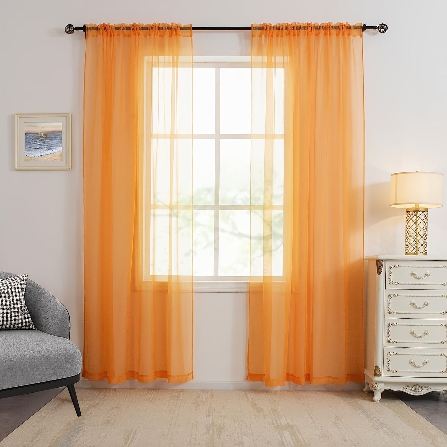 Two panels of sheer curtains with a basic rod pocket design, perfect for adding a touch of elegance to your bedroom, office, living room, yard, kitchen, or any other space in your home.