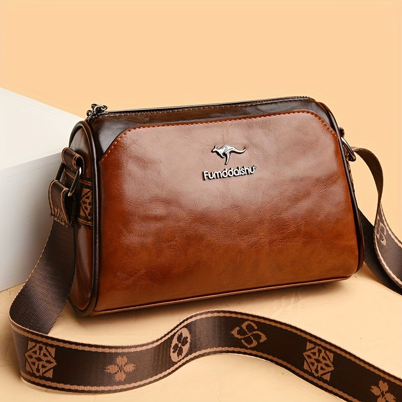 Water-resistant crossbody bag for women with adjustable strap, zipper closure, and polyester lining.