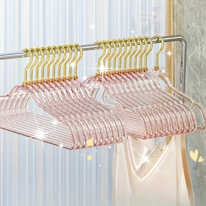 A set of 12 premium acrylic hangers with a non-slip, sparkling transparent design, providing a firm grip for wardrobe storage. These durable, thick hangers are perfect for bedroom closets, offering a traceless hanging solution.