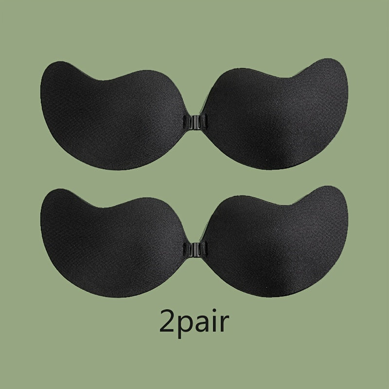 2 pairs of self-adhesive, strapless lifting bras with slip-proof design for women. Mango shaped straps, polyester & silicone blend. Hand wash only. Ideal for vests & dresses.