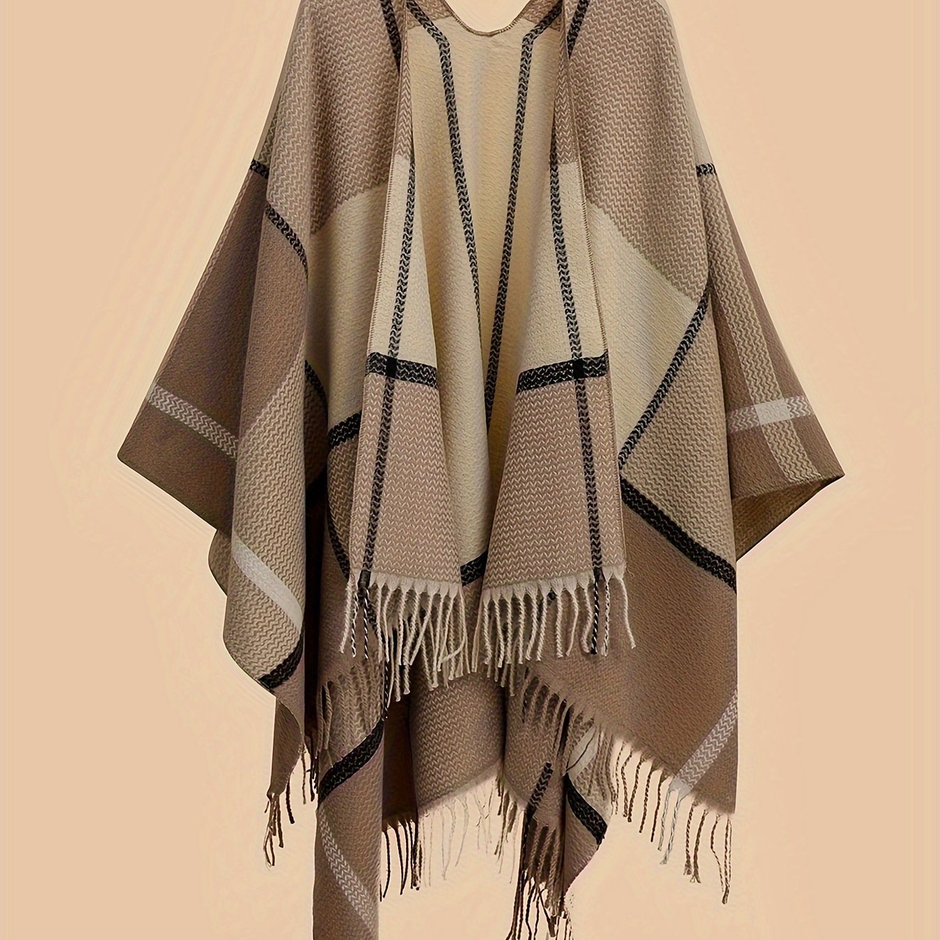 Stylish plus size shawl cardigan with tassels for fall/winter parties features v-neck, asymmetrical hem, and geometric pattern.