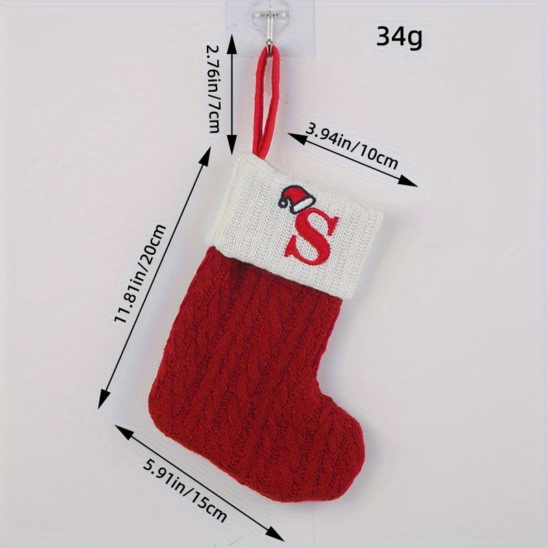 Knitted letter Christmas socks for home tree ornaments; red socks in gift bag for festive attire.