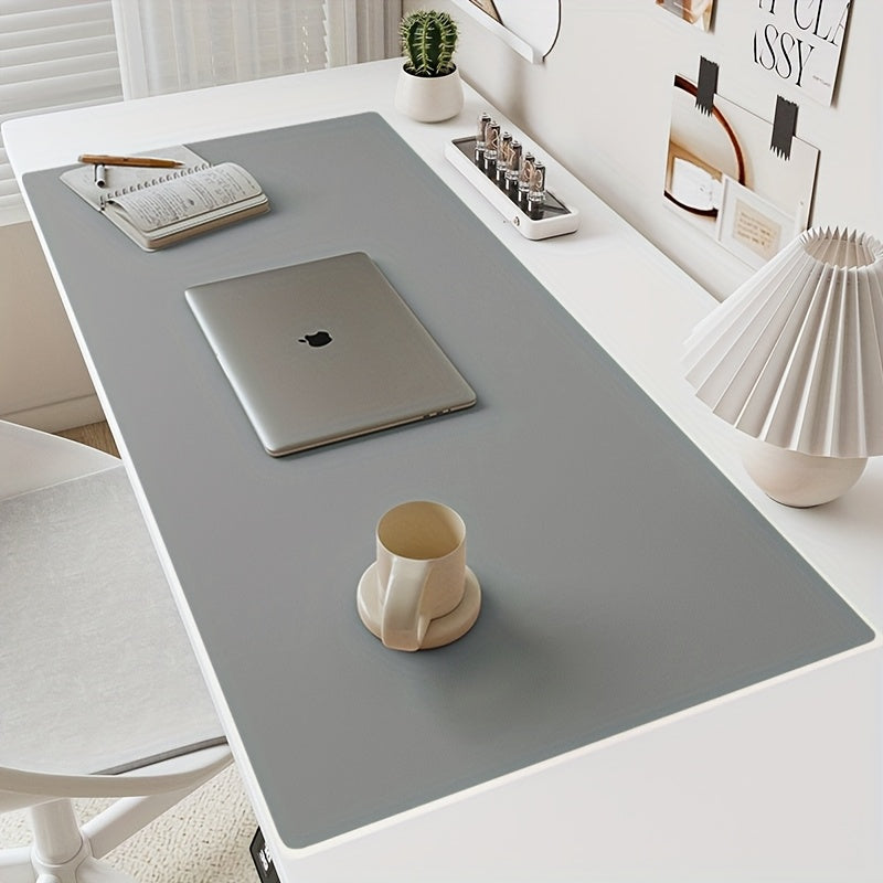 Waterproof faux leather desk mat for office use, non-slip and solid color with mouse pad & keyboard protector.