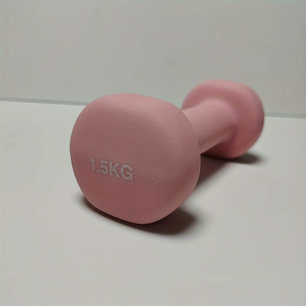 1pc 2kg dumbbell in pink/blue/black colors, made of solid cast iron for home gym. Durable and stylish fitness accessory for both men and women.