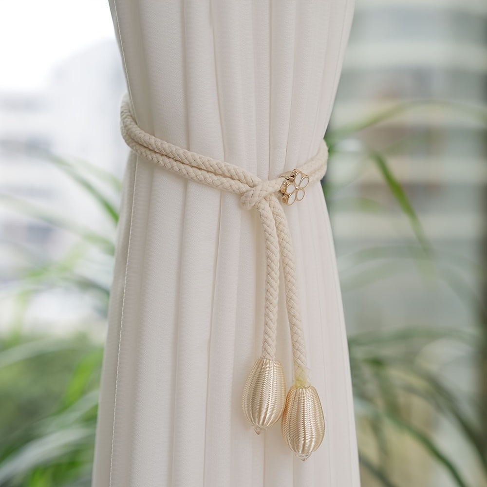 Two pieces of stylish adjustable curtain tiebacks with a modern floral buckle design and pearl accent. Made from polyester rope, these holders are perfect for adding an elegant touch to your window decor.