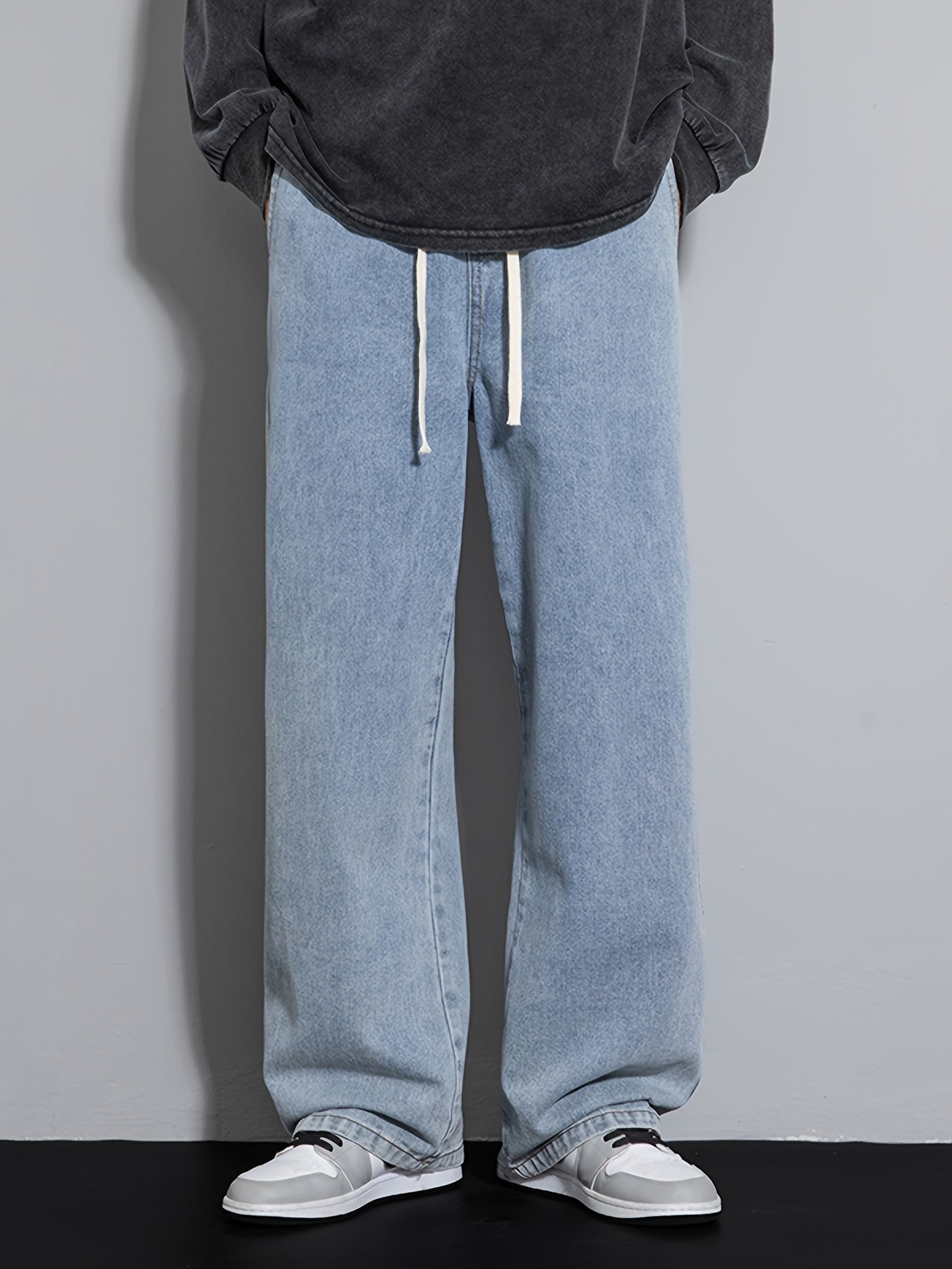 Men's wide leg denim jeans with drawstring waist, loose fit for hip-hop style.