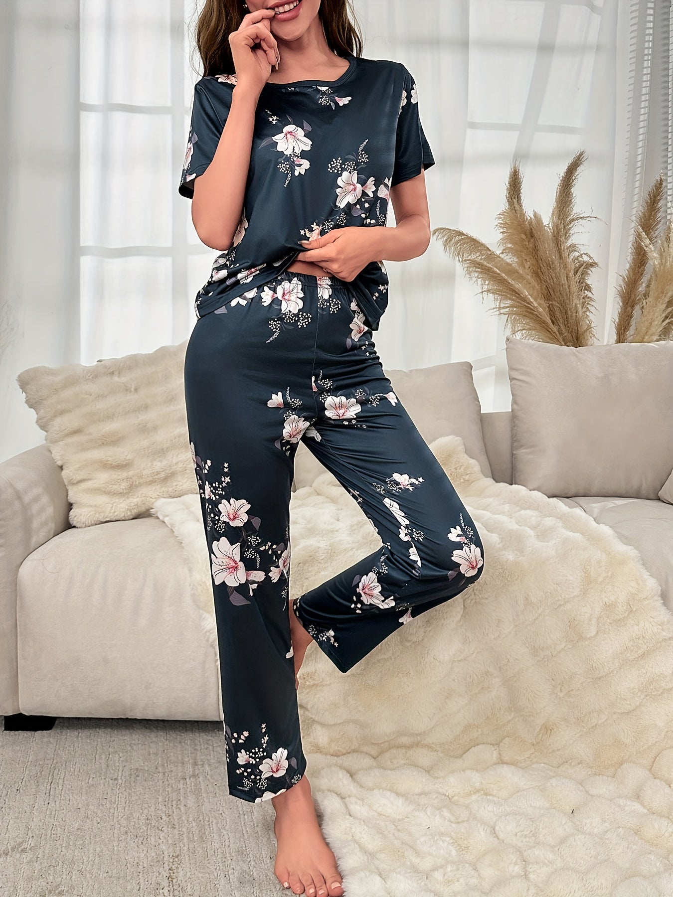 Women's floral print pajama set with short-sleeve top and elastic waistband pants - perfect for sleepwear and loungewear.